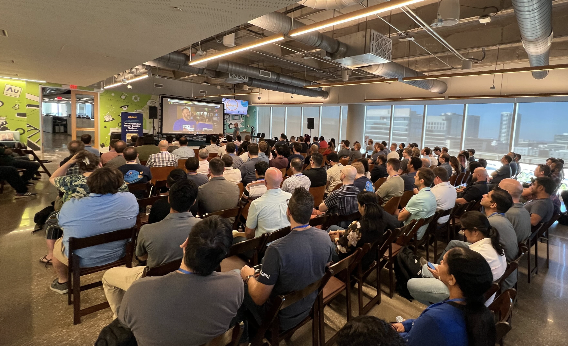 Engineering team members gathered together during a hackathon demo ceremony showcasing innovative banking solutions