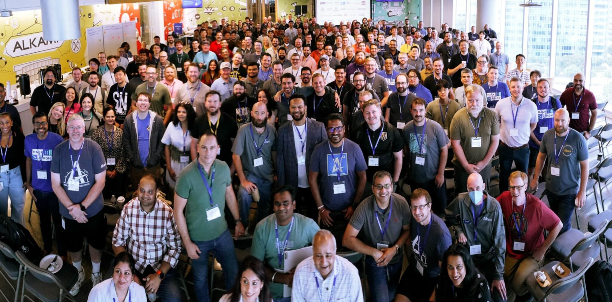 Hackathon kickoff group photo with Alkami employees, clients, and partners collaborating on the digital banking platform.
