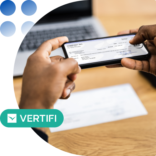 Person holds a smartphone showing a check/receipt, with a laptop blurred in the background; Vertifi badge overlaid on the image.