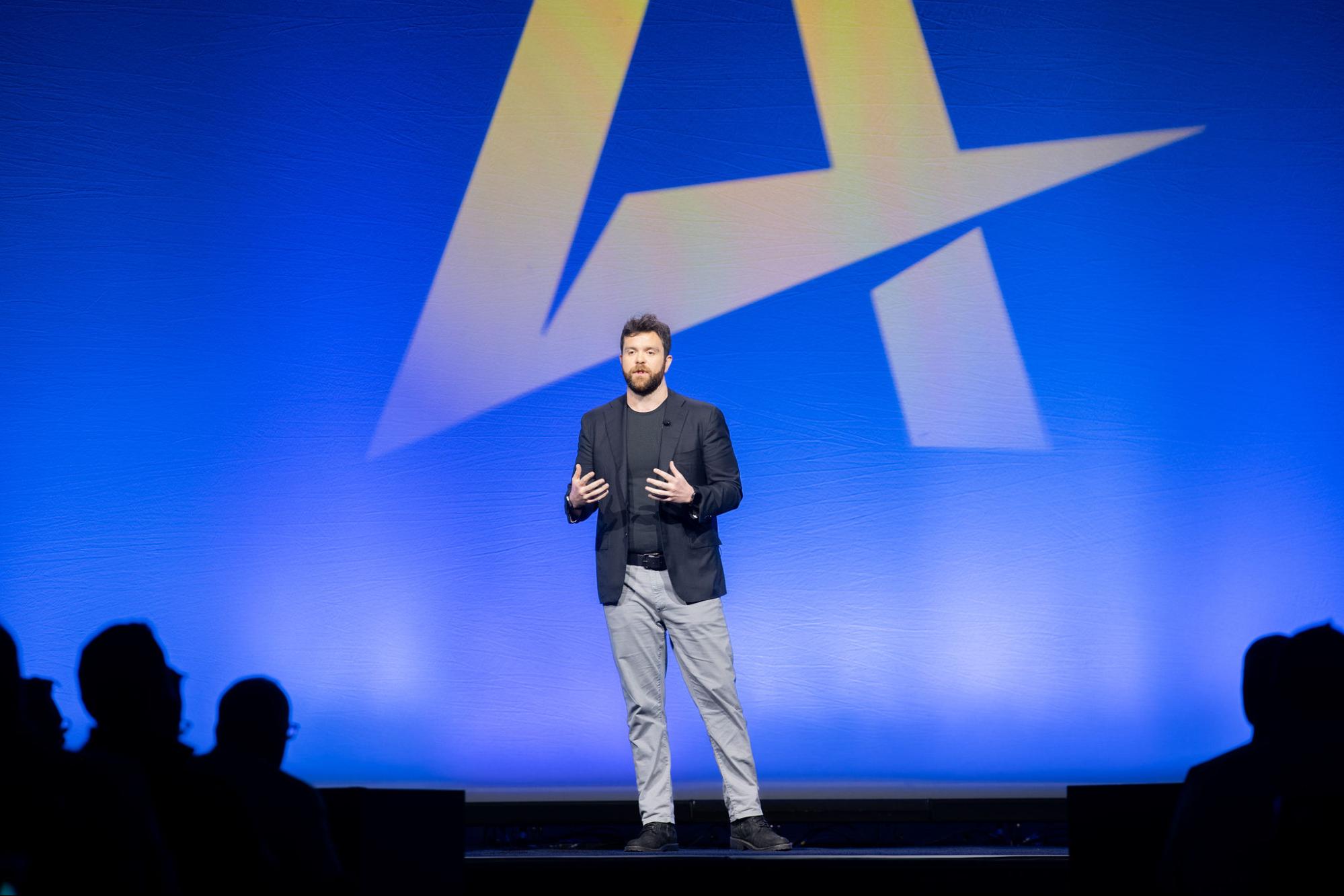 conant-main-stage-2026 - Alkami Technology Alkami Chief Product Officer Benjamin Conant on the Alkami Co:lab mainstage greeting the audience