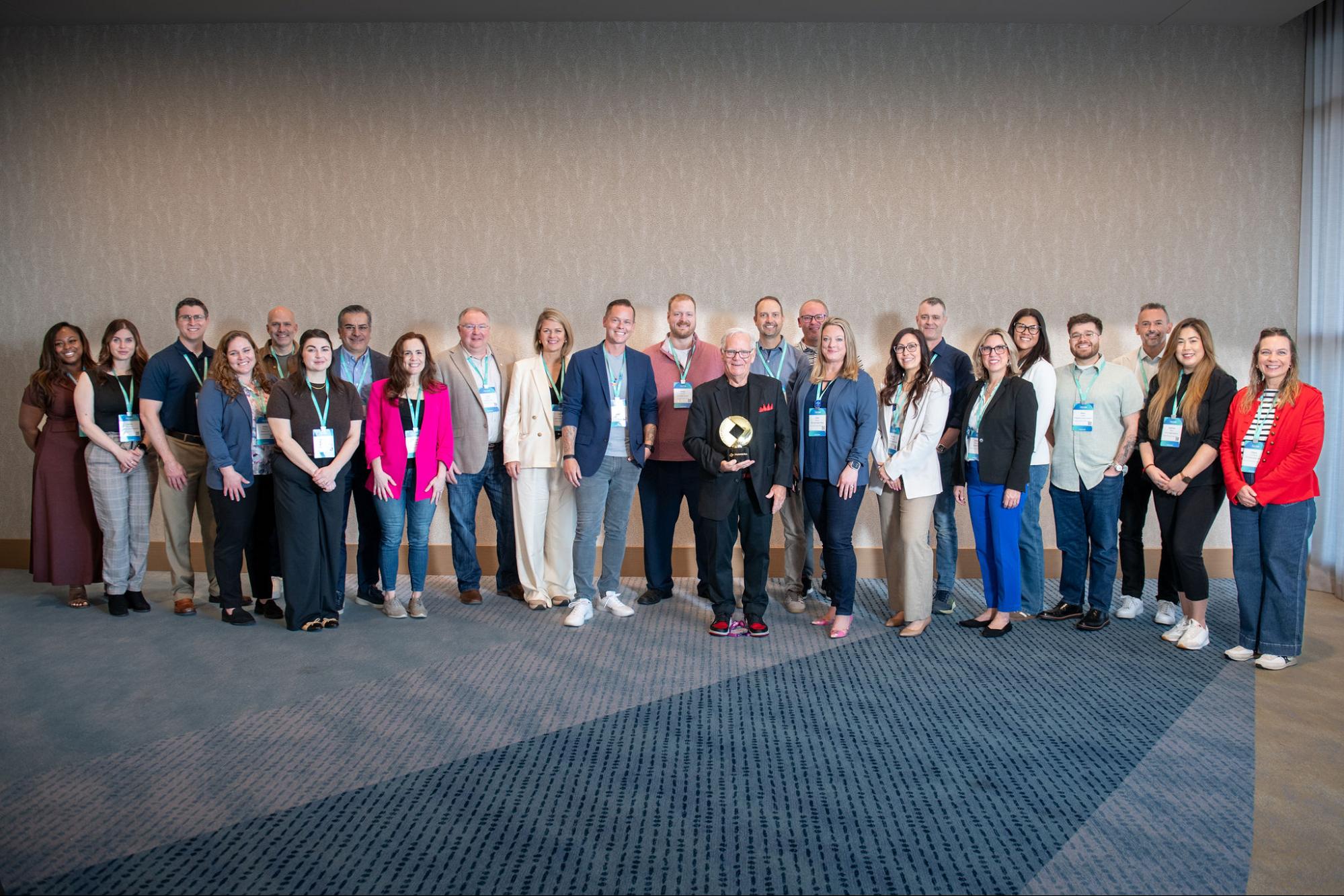 fisionaries-awards-2026 - Alkami Technology A group of bankers with their 2026 “FIsionaries” Awards, standing with FIsionaries producer Courtney Tyes and Host Jim Marous.