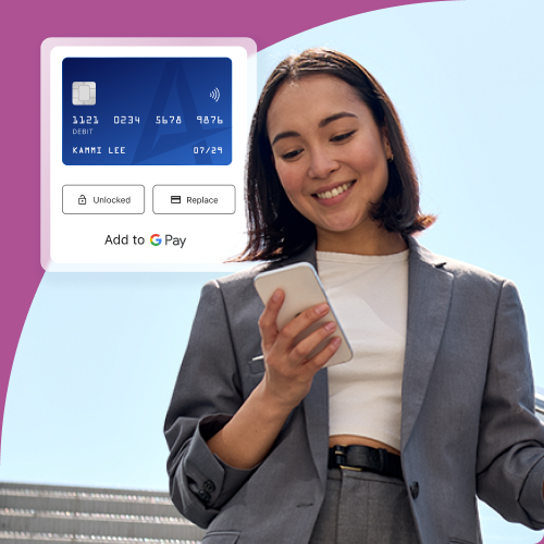 Smiling woman in a gray blazer holds a smartphone with a payment terminal graphic showing a card and the text 'Add to Google Pay'.
