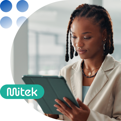 Professional woman in a beige blazer using a tablet in an office, with a teal Nitek logo graphic.
